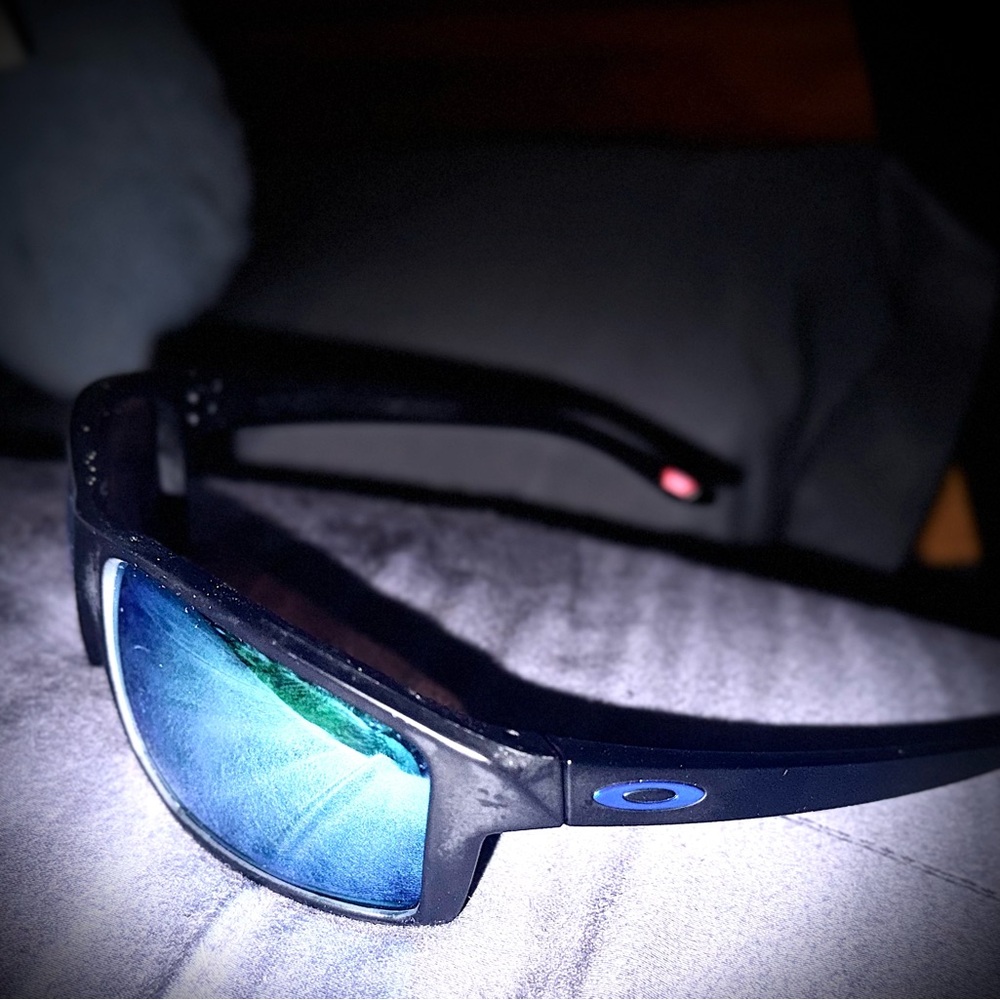 Oakley Sunglasses with Black Frame and Reflective Blue Lenses